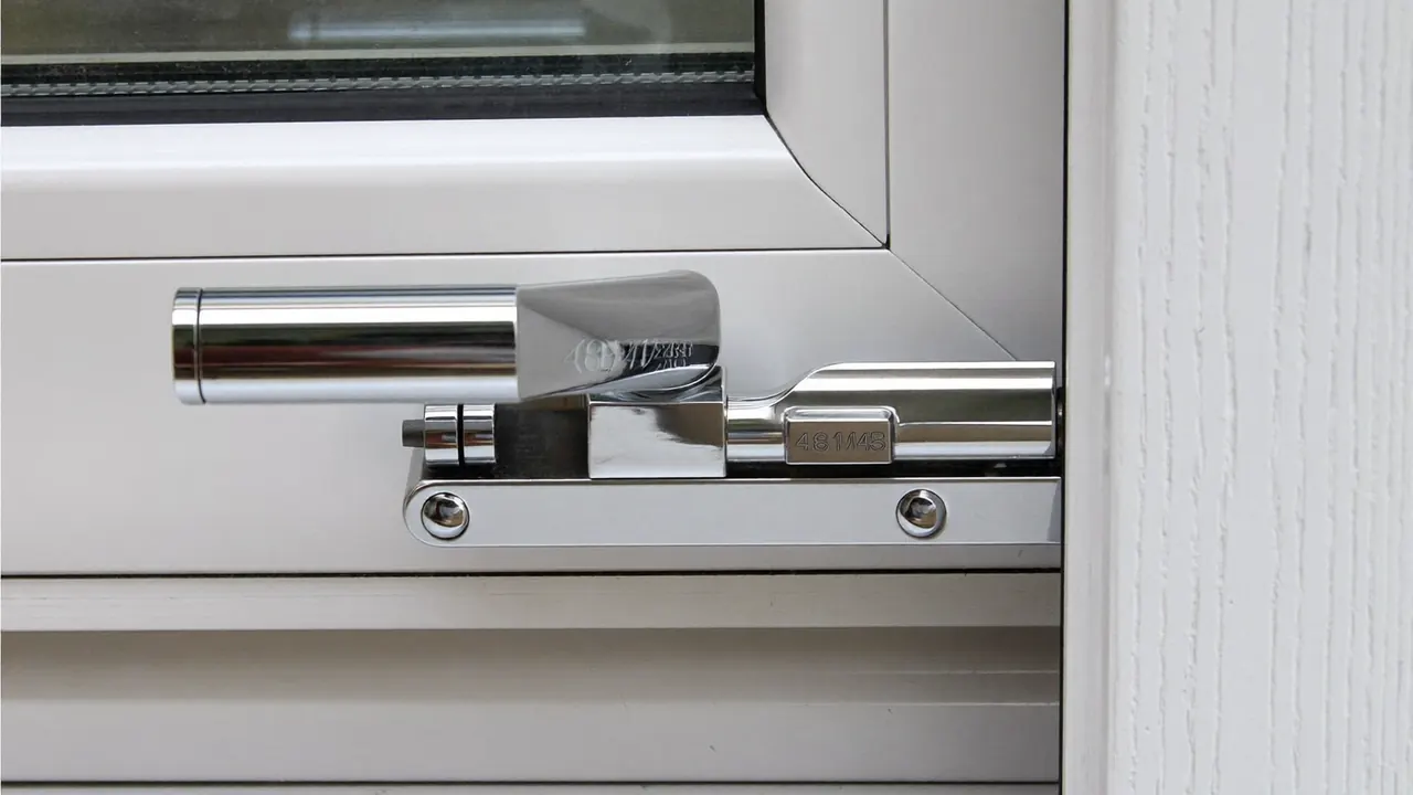 Close-up of a locking handle and multipoint lock on a new window